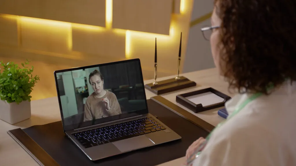 Healthcare professional using video interpreting during a remote consultation